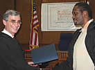Judge Ferrera hands graduate Certificate of Completion